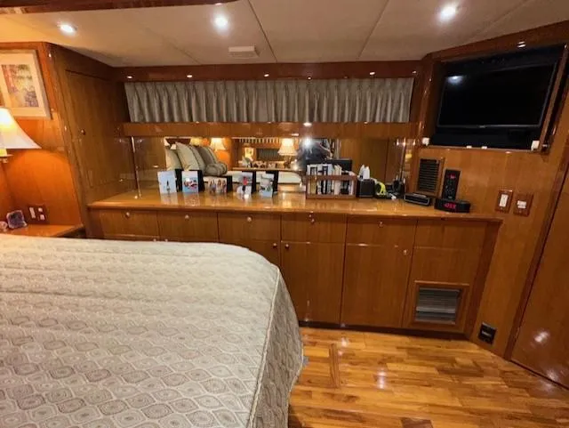 Perfect Fit Yacht Photos Pics Luxurious cabin interior of 2000 Jefferson Marquessa 60 Cockpit yacht with wood finishes.