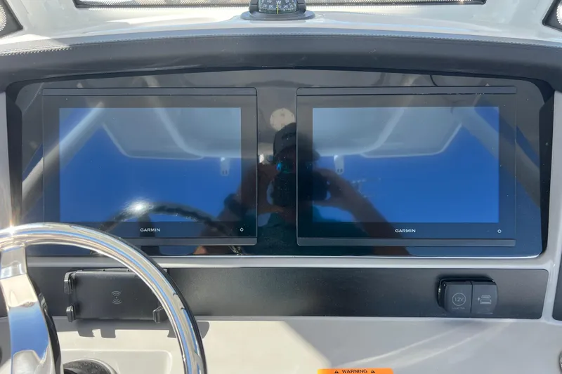  Yacht Photos Pics 2026 Robalo R250 Center Console with dual Garmin displays on the dashboard.