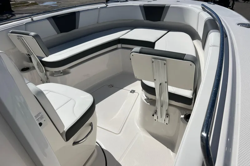  Yacht Photos Pics 2026 Robalo R250 Center Console boat interior with cushioned seating and sleek design.