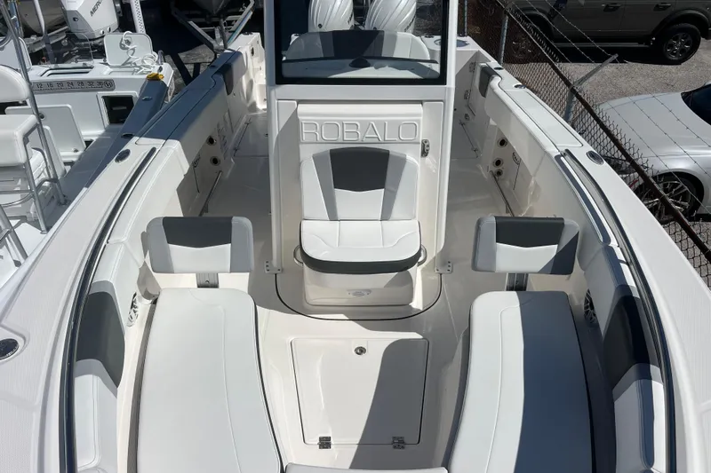  Yacht Photos Pics 2026 Robalo R250 Center Console boat interior with white seating and console.