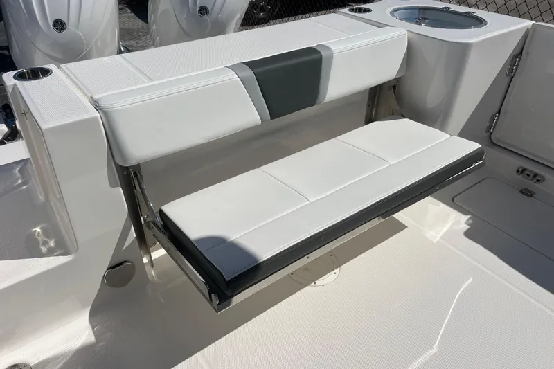  Yacht Photos Pics 2026 Robalo R250 Center Console boat with foldable white seating.