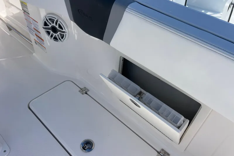  Yacht Photos Pics 2026 Robalo R250 Center Console boat interior with storage compartment and speaker.