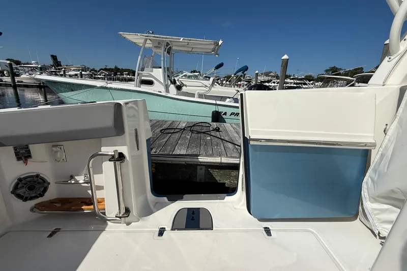  Yacht Photos Pics 2024 Boston Whaler 420 Outrage at dock, showcasing interior and exterior features.