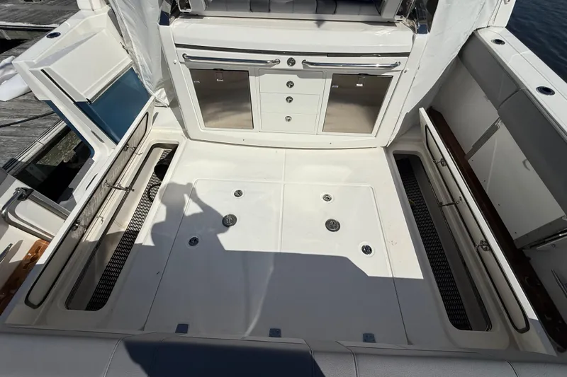  Yacht Photos Pics 2024 Boston Whaler 420 Outrage deck with storage compartments and cabinetry.