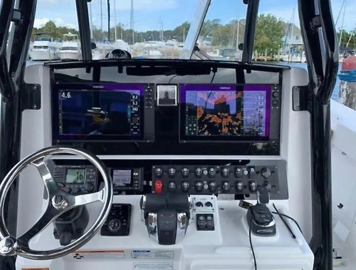  Yacht Photos Pics Control panel of a 2020 Southport 33 FE boat with navigation screens.