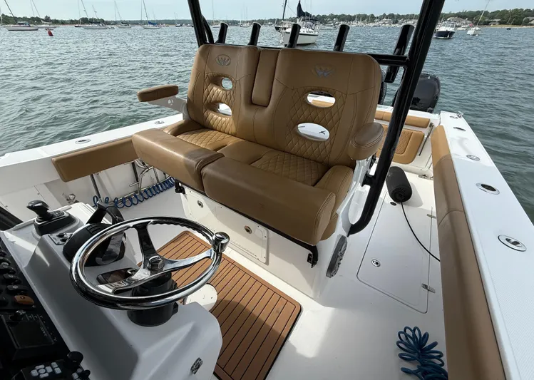  Yacht Photos Pics 2020 Southport 33 FE boat interior with tan leather seating and steering wheel.
