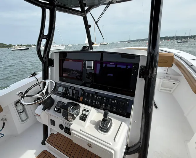  Yacht Photos Pics 2020 Southport 33 FE boat helm with advanced navigation system and steering wheel.