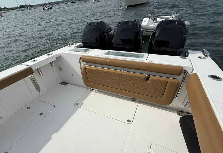  Yacht Photos Pics 2020 Southport 33 FE boat with triple engines and tan seating on open water.