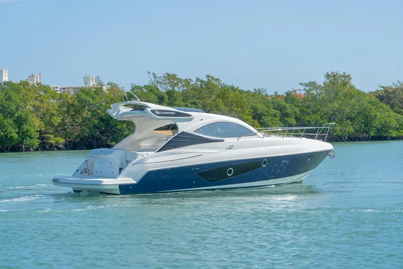  Yacht Photos Pics 2022 Schaefer 375 HT yacht cruising on a serene waterway.