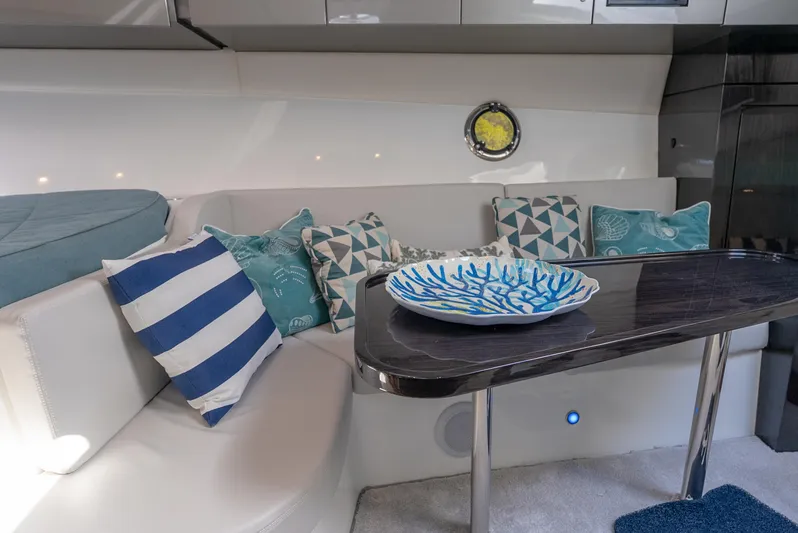  Yacht Photos Pics Interior of 2022 Schaefer 375 HT yacht with stylish seating and decorative pillows.