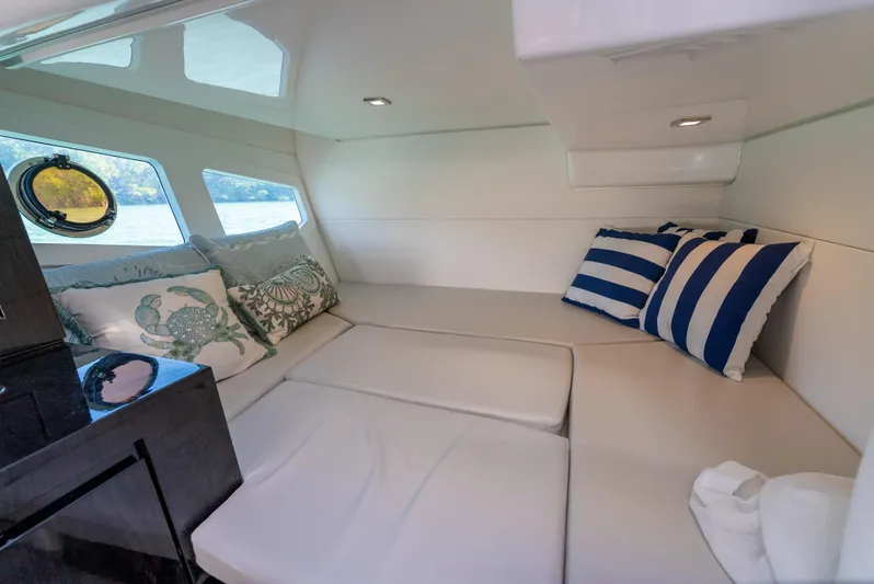  Yacht Photos Pics Interior cabin of 2022 Schaefer 375 HT yacht with cozy seating and decorative pillows.