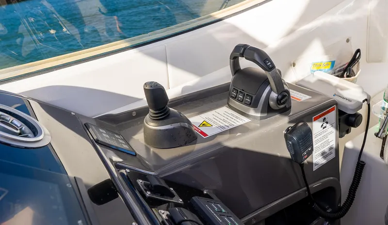  Yacht Photos Pics Control panel of 2022 Schaefer 375 HT boat with joystick and throttle.