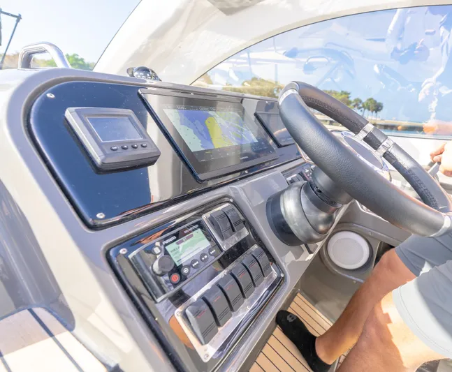  Yacht Photos Pics 2022 Schaefer 375 HT yacht dashboard with navigation controls and steering wheel.