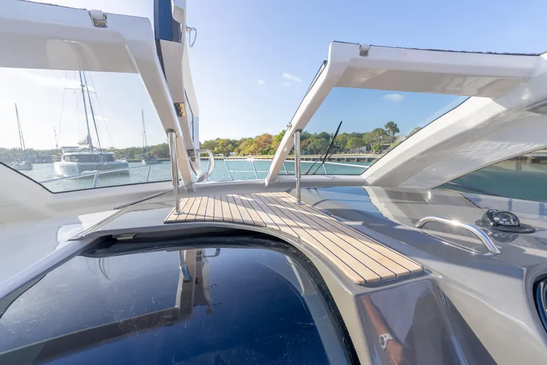  Yacht Photos Pics Schaefer 375 HT 2022 yacht deck with open canopy, docked in a sunny marina.