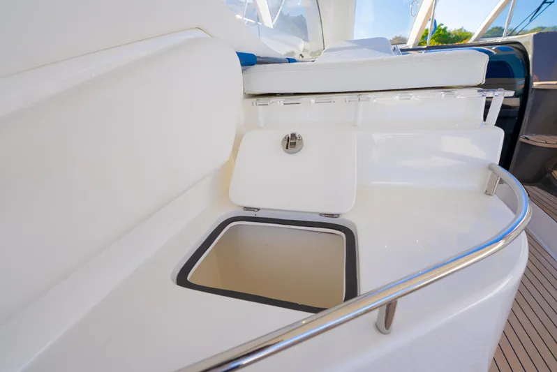  Yacht Photos Pics 2022 Schaefer 375 HT yacht interior with open storage compartment and sleek design.