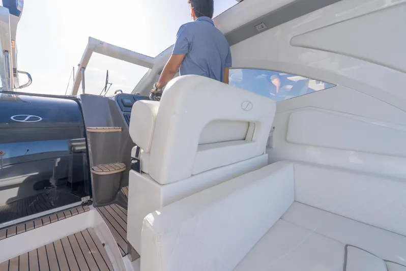  Yacht Photos Pics 2022 Schaefer 375 HT yacht interior with white seating and modern helm.