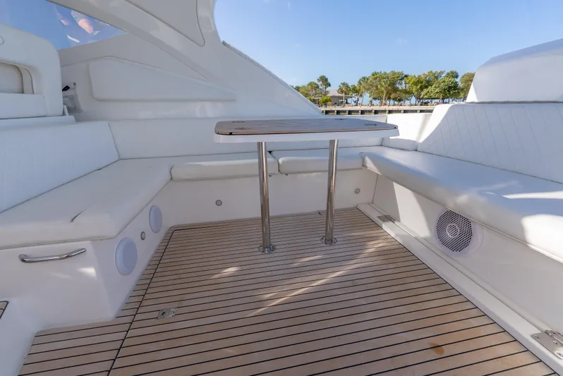  Yacht Photos Pics 2022 Schaefer 375 HT yacht interior with white seating and wooden flooring.