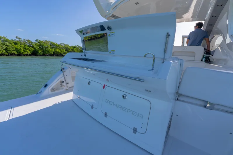  Yacht Photos Pics Schaefer 375 HT 2022 yacht with outdoor kitchen, cruising on a sunny day.