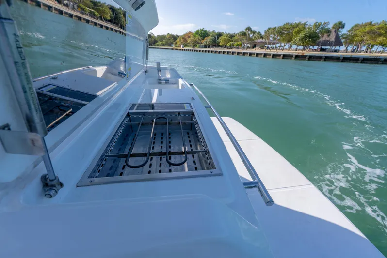  Yacht Photos Pics 2022 Schaefer 375 HT boat on water, showcasing sleek deck design and scenic surroundings.