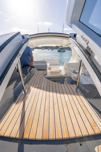  Yacht Photos Pics 2022 Schaefer 375 HT yacht with open deck, wooden flooring, and scenic water view.