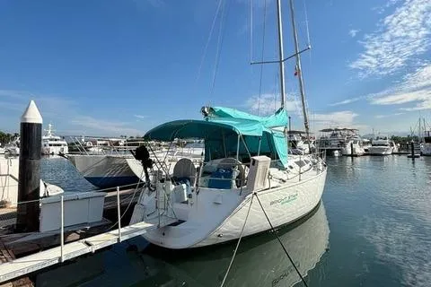  Yacht Photos Pics 2002 Jeanneau Sun Odyssey 40 sailboat docked at marina under clear blue sky.