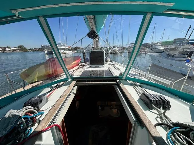  Yacht Photos Pics Cockpit view of 2002 Jeanneau Sun Odyssey 40 sailboat docked in marina.