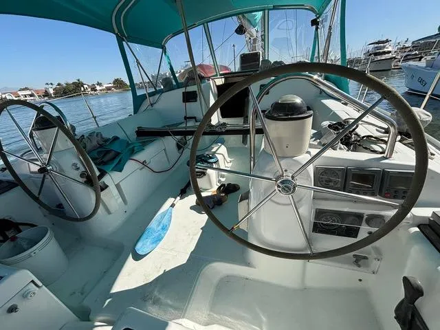  Yacht Photos Pics 2002 Jeanneau Sun Odyssey 40 sailboat cockpit with dual steering wheels and navigation instruments.
