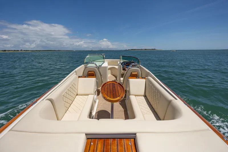  Yacht Photos Pics 2022 Chris-Craft Launch 27 boat on open water, featuring luxurious seating and elegant design.