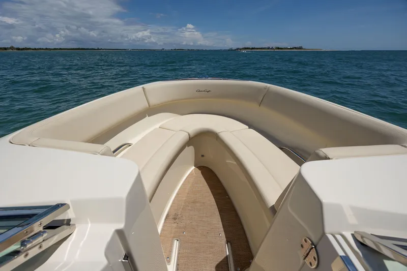  Yacht Photos Pics 2022 Chris-Craft Launch 27 boat interior with beige seating on open water.