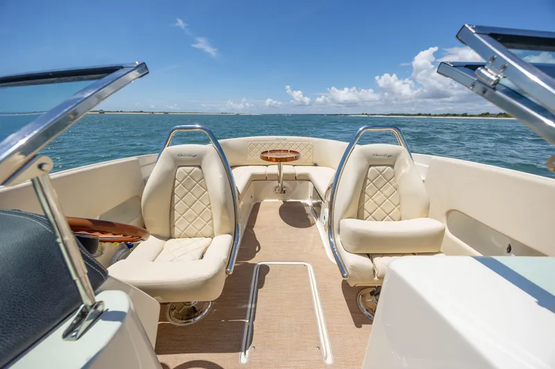  Yacht Photos Pics 2022 Chris-Craft Launch 27 boat interior with luxurious seating on open water.