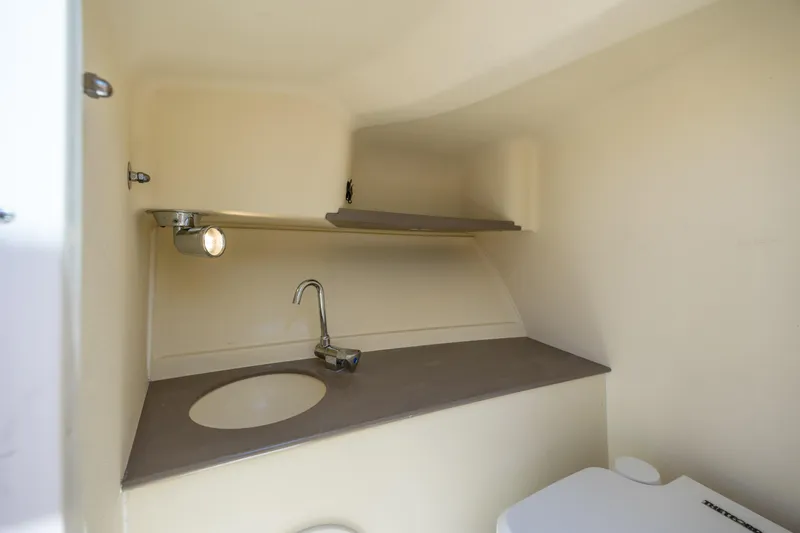  Yacht Photos Pics 2022 Chris-Craft Launch 27 boat interior with sink and toilet.