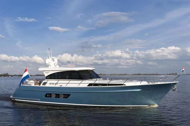  Yacht Photos Pics 2012 Vivante 55 HT yacht cruising on calm waters under a partly cloudy sky.