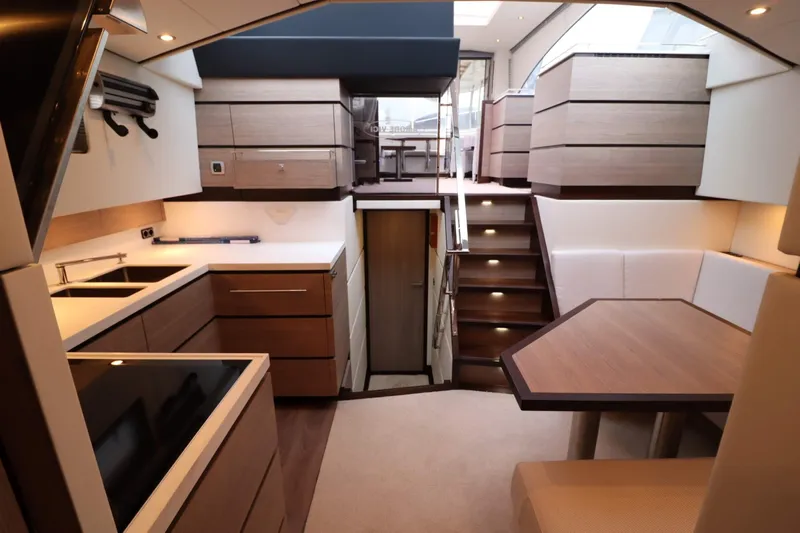  Yacht Photos Pics Luxurious interior of 2012 Vivante 55 HT yacht with modern kitchen and dining area.