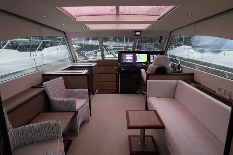  Yacht Photos Pics Luxurious interior of 2012 Vivante 55 HT yacht with modern seating and navigation area.