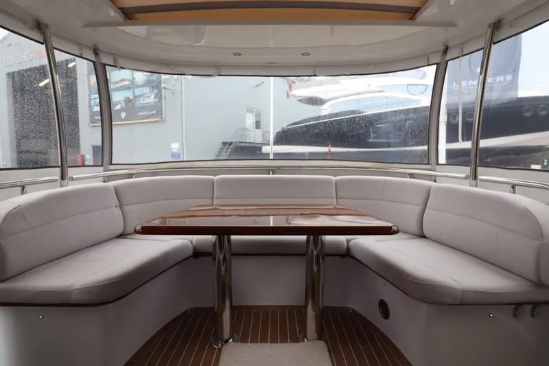  Yacht Photos Pics Luxurious interior of 2012 Vivante 55 HT yacht with elegant seating and wooden table.