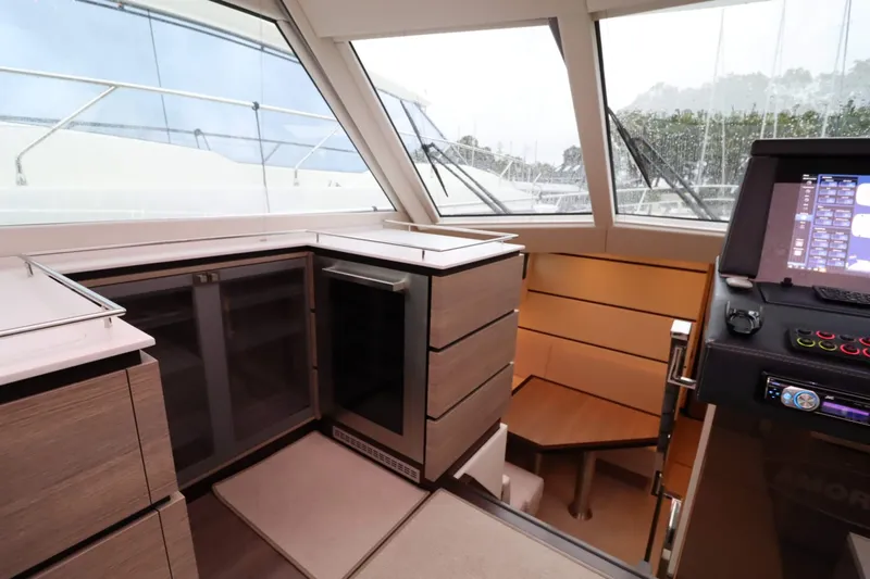  Yacht Photos Pics Luxurious interior of 2012 Vivante 55 HT yacht with modern cabinetry and navigation controls.