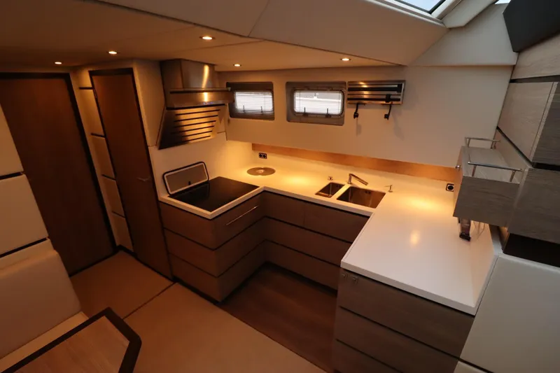  Yacht Photos Pics Luxurious kitchen interior of 2012 Vivante 55 HT yacht with modern design and ample lighting.