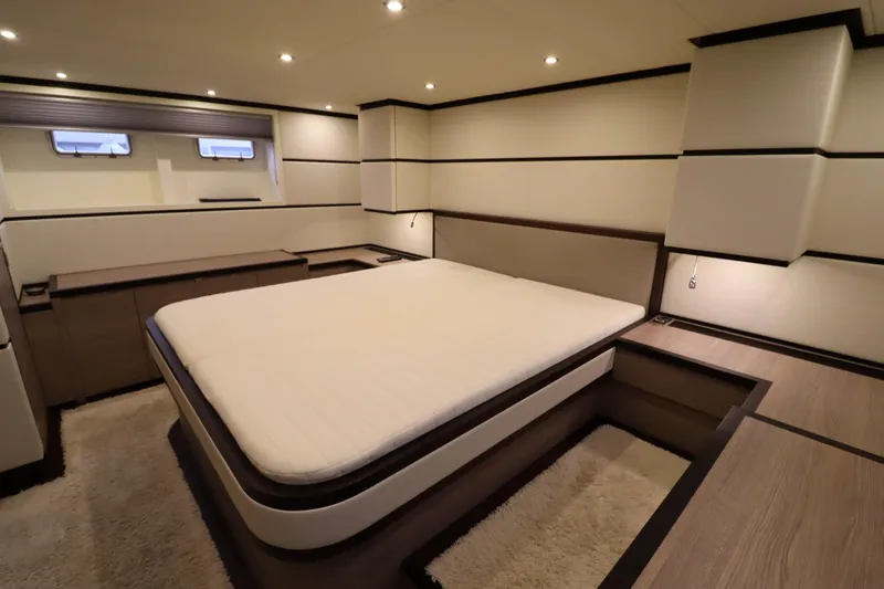  Yacht Photos Pics Luxurious bedroom interior of 2012 Vivante 55 HT yacht with modern design and ambient lighting.