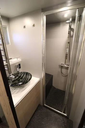  Yacht Photos Pics Modern bathroom in 2012 Vivante 55 HT yacht with sleek sink and shower.