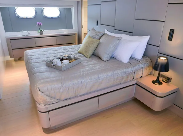  Yacht Photos Pics Luxurious bedroom interior on a 2008 Admiral 85 yacht, featuring elegant decor and modern furnishings.