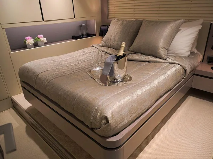  Yacht Photos Pics Luxurious bedroom in 2008 Admiral 85 yacht with champagne on bed.