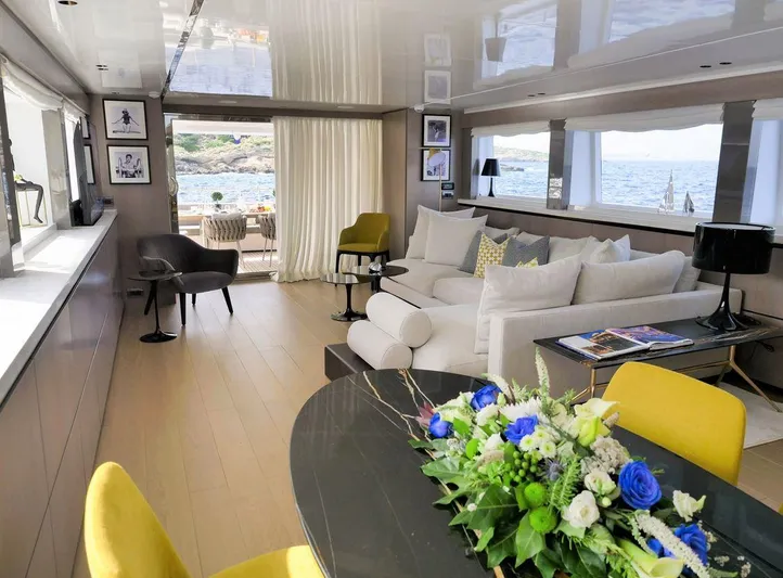  Yacht Photos Pics Luxurious Admiral 85 yacht interior with elegant seating, floral centerpiece, and ocean view, 2008 model.