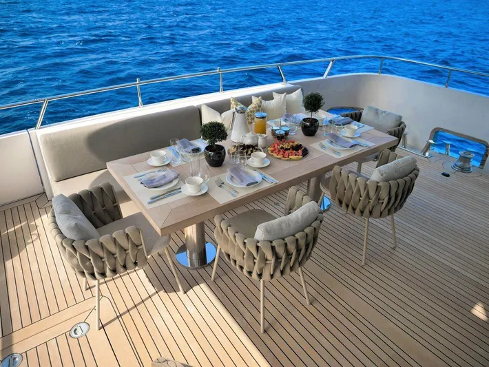  Yacht Photos Pics Luxury dining setup on Admiral 85 yacht, 2008 model, with ocean view.