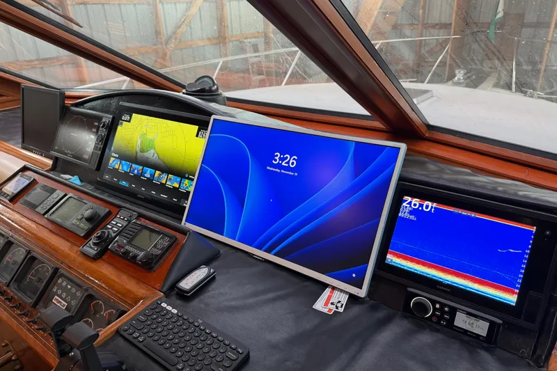 Bonnie Jean Yacht Photos Pics 1998 Ocean Alexander Pilothouse Model 584 helm with navigation and control systems.