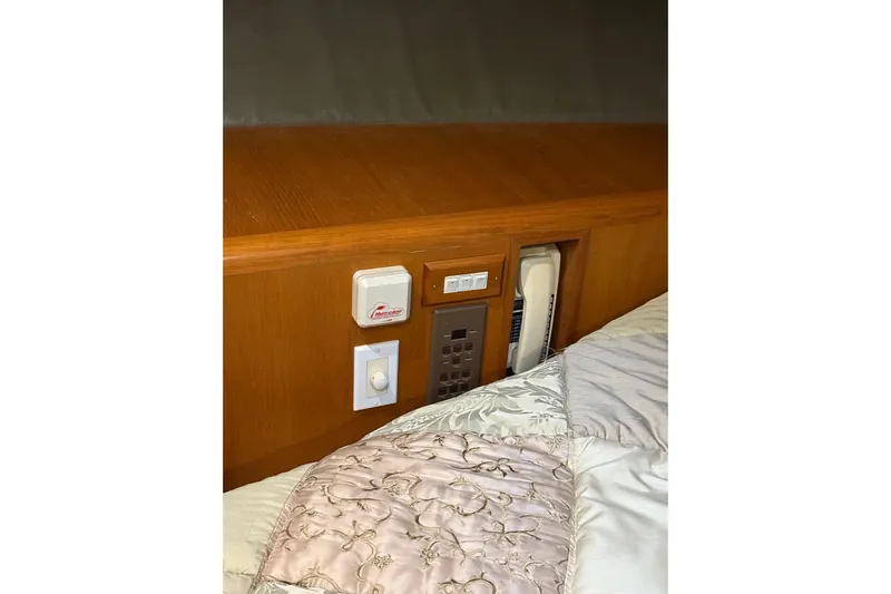 Bonnie Jean Yacht Photos Pics Control panel and phone in Ocean Alexander Pilothouse Model 584, 1998 yacht interior.