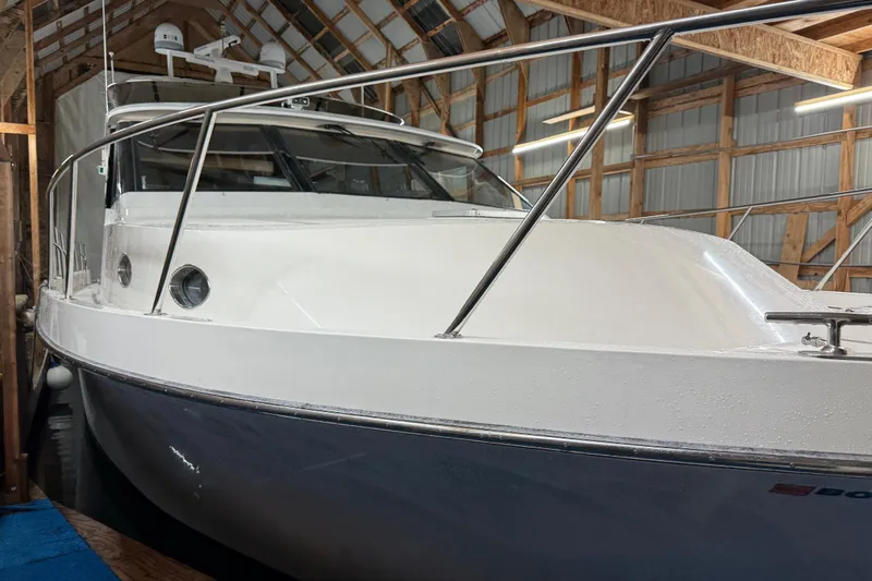 Bonnie Jean Yacht Photos Pics 1998 Ocean Alexander Pilothouse Model 584 yacht in a wooden boathouse.