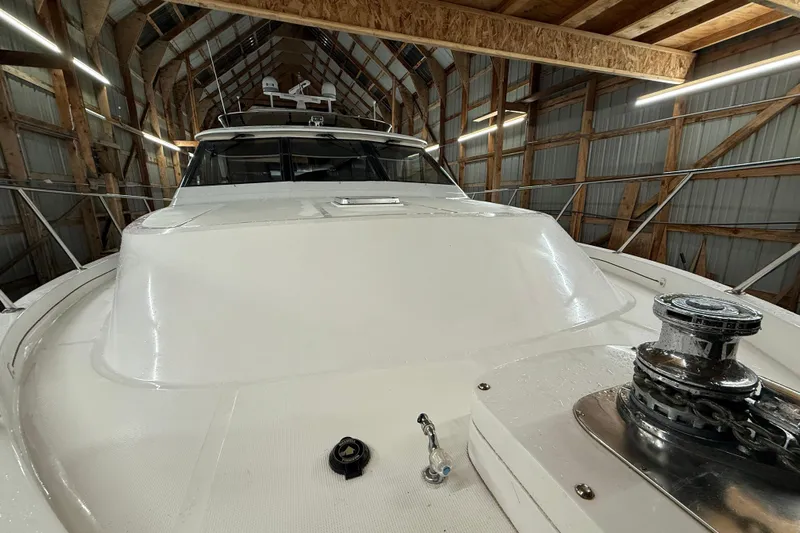 Bonnie Jean Yacht Photos Pics 1998 Ocean Alexander Pilothouse Model 584 yacht in a wooden boathouse.