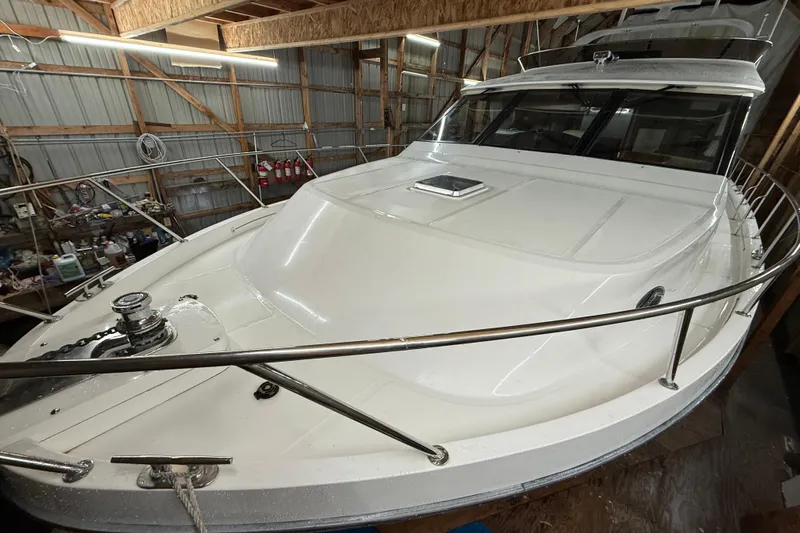 Bonnie Jean Yacht Photos Pics 1998 Ocean Alexander Pilothouse Model 584 yacht in a wooden boathouse.
