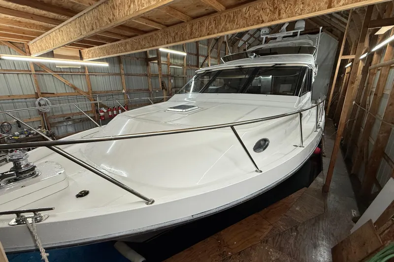Bonnie Jean Yacht Photos Pics 1998 Ocean Alexander Pilothouse Model 584 yacht in a wooden storage facility.