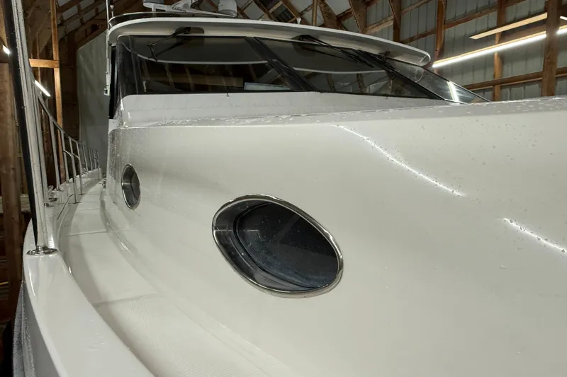 Bonnie Jean Yacht Photos Pics 1998 Ocean Alexander Pilothouse Model 584 yacht in a wooden boathouse.
